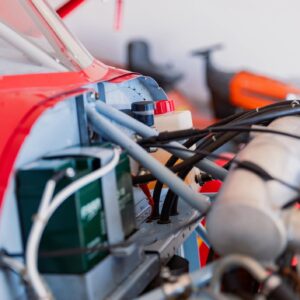 Vintage engine bay ignition wiring and components detail close-up