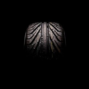 Classic Fuchs-style alloy wheel close-up on a clean neutral background